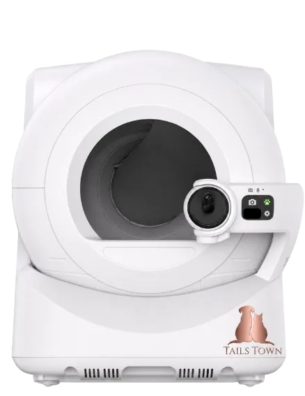 Rounded white enclosed litter box with Tail's Town logo printed on the side